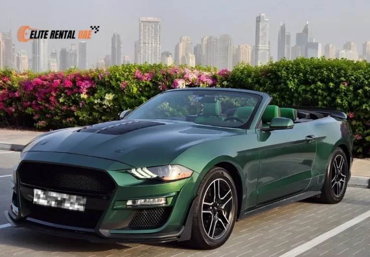 Ford Mustang Convertible Green driving in Dubai available for hire all over the UAE