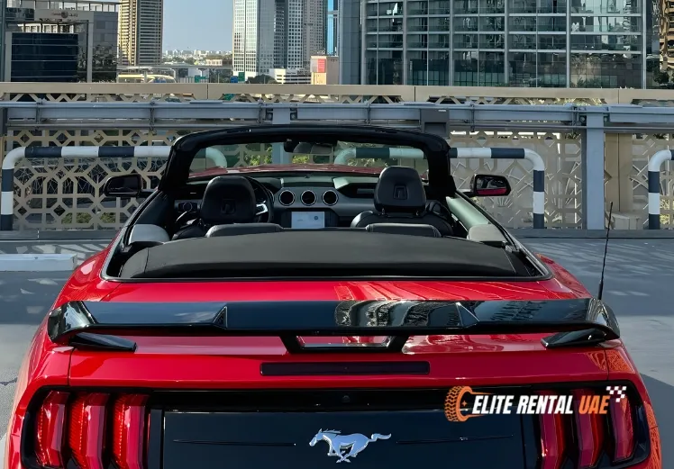 ord Mustang Convertible Red driving in Dubai available for hire across the UAE