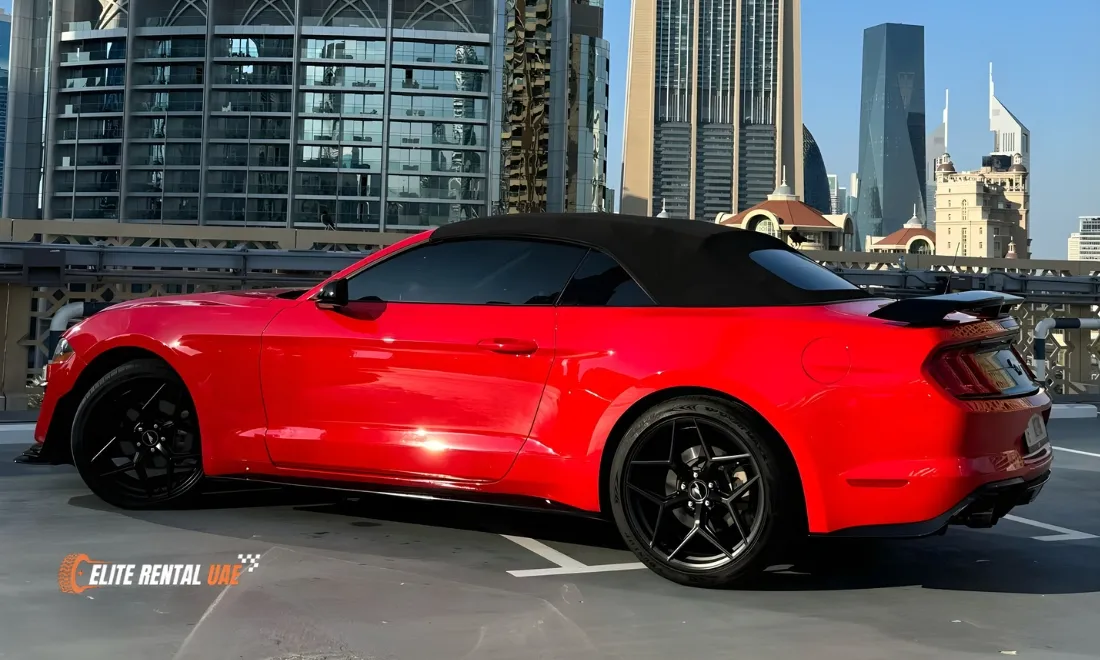 Ford Mustang Convertible Red side profile available for hire in Dubai and across the UAE