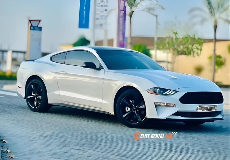 Side view of white Ford Mustang Coupe showcasing sporty design for car rental