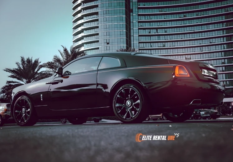 Side profile of black Rolls Royce Wraith showcasing bold luxury coupe design