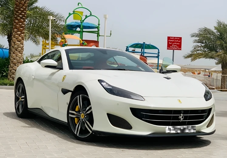 Ferrari Portofino side front view luxury convertible sports car rental in Dubai UAE