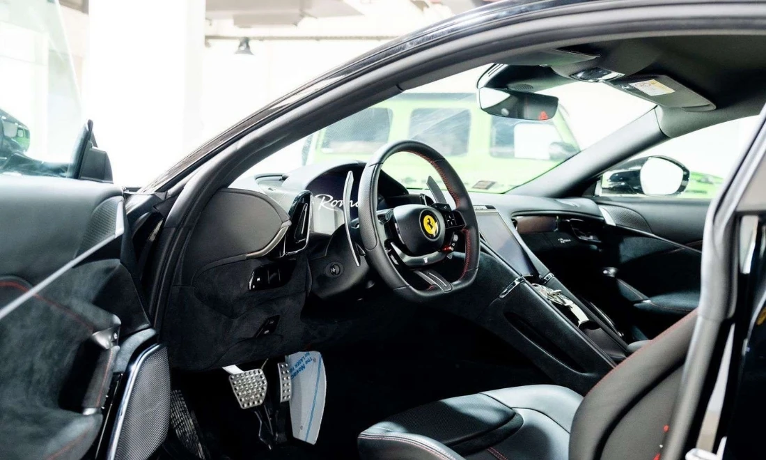 Ferrari Roma cockpit interior with luxury leather dashboard supercar rental Dubai UAE