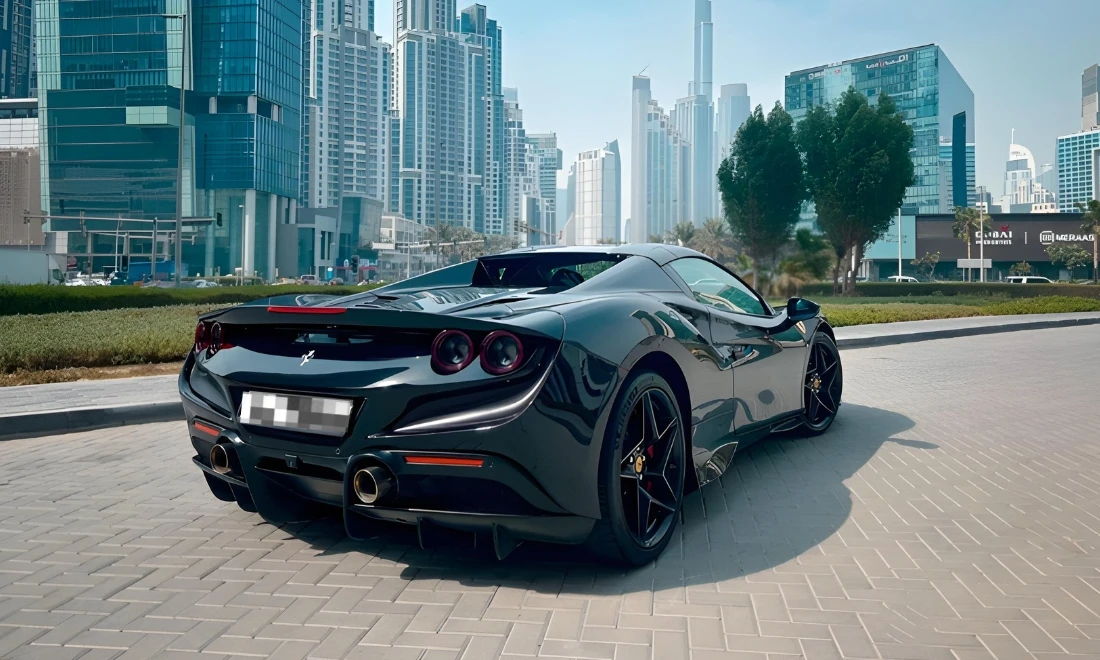 Red Ferrari F8 Tributo Spider rear view exotic convertible sports car rental in Dubai UAE