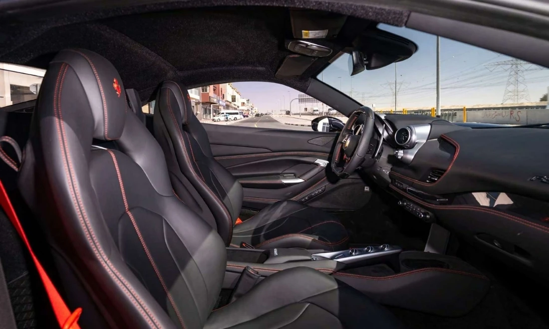 Ferrari F8 interior cockpit with premium sports seats luxury supercar rental Dubai UAE