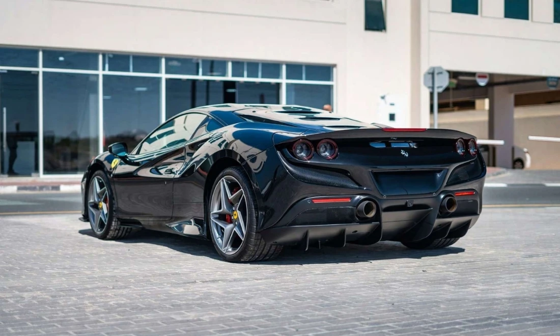 Ferrari F8 rear side angle exotic sports car parked in Dubai available for rent UAE